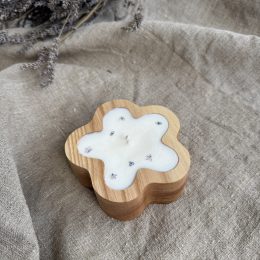 Handmade sandalwood saoy candle in flower-shaped wood vessel