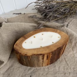 Handmade magnolia soy candle in antique elm wood vessel