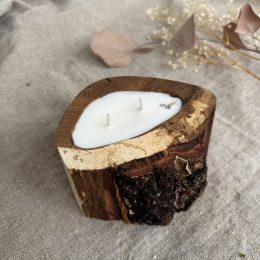 Handmade Melon soy wax candle in natural oak wood vessel with two cotton wicks and natural bark edge