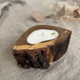 Handmade unscented soy wax candle in natural oak wood vessel with single cotton wick and natural bark edge