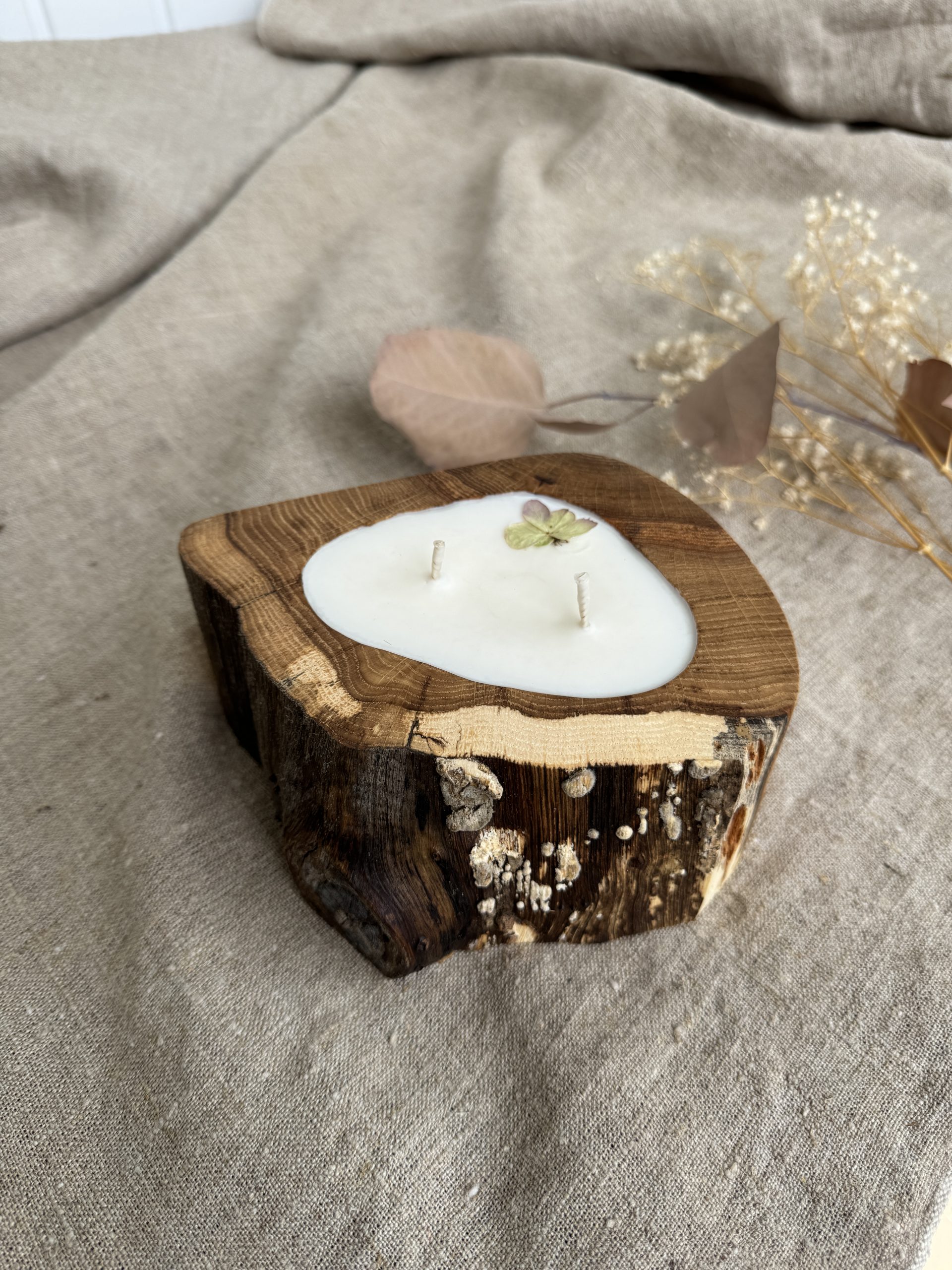 Handmade Peony soy wax candle in natural oak wood vessel with two cotton wicks and natural wood grain