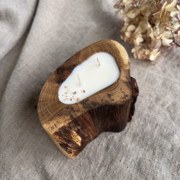 Handmade unscented soy wax candle in natural oak wood vessel with two cotton wicks and natural wood grain