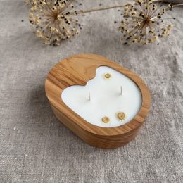 Handmade unscented soy wax candle in natural ash wood vessel with two cotton wicks and organic shape