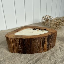 Handmade coffee scented candle in a natural elm wood bowl decorated with coffee beans and dried flowers
