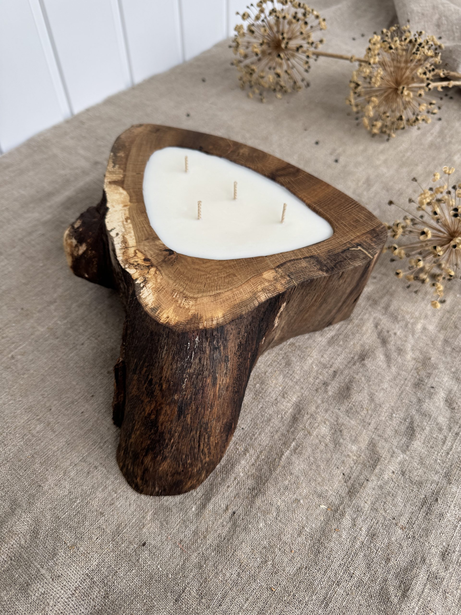 Handmade oak wood candle with four wicks and Sienna Elegance fragrance in a unique natural wooden vessel