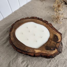 Large handmade oak wood candle with nine cotton wicks in a natural oak wood vessel with bark edge